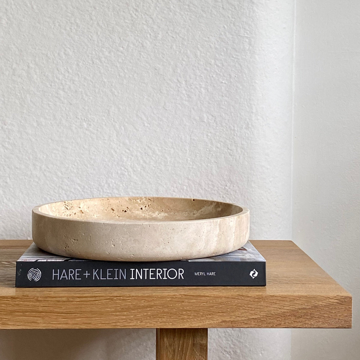 Travertine bowl on hare klein interiors book
