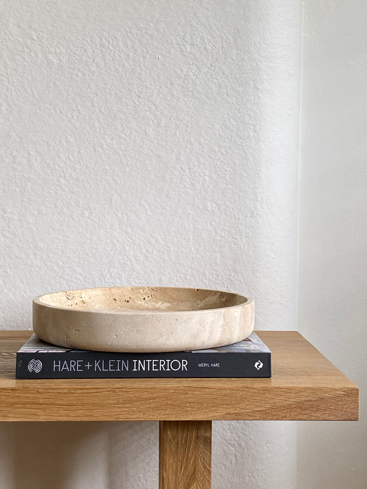 Travertine bowl on hare klein interiors book